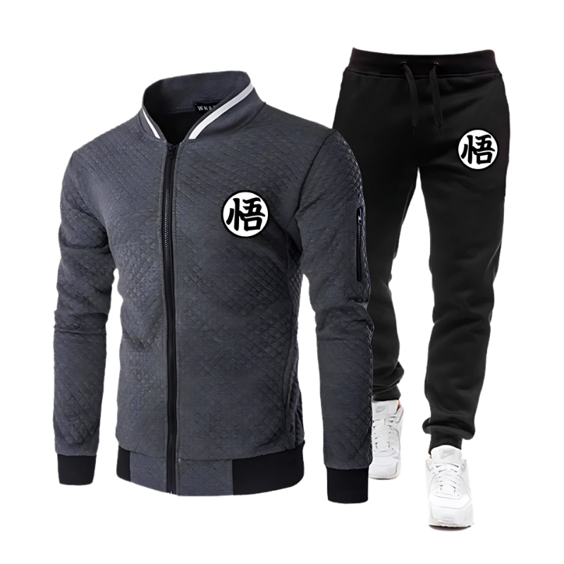 Set tendance avec une veste matelassée grise à fermeture zippée et un pantalon jogging noir. Symbole Goku brodé, idéal pour les fans de Dragon Ball Z.