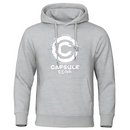 Sweat à capuche gris clair Capsule Corp avec logo glitché blanc, design moderne et inspiré de Dragon Ball.