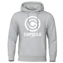 Sweat gris clair avec capuche, logo Capsule Corporation blanc sur la poitrine, design élégant inspiré de Dragon Ball Z.