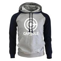 Sweat à capuche bicolore avec un corps gris clair et des manches navy contrastantes, orné du logo blanc Capsule Corp sur le devant. Le hoodie comporte une poche kangourou pratique et des cordons assortis noirs pour un look moderne et confortable, parfait pour les amateurs de mode geek.