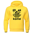 Sweat à capuche jaune vif avec logo noir représentant la maison de Kame (Tortue Géniale) et des palmiers, inspiré de l'univers Dragon Ball, parfait pour un style audacieux et geek.

