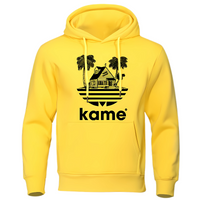 Sweat à capuche jaune vif avec logo noir représentant la maison de Kame (Tortue Géniale) et des palmiers, inspiré de l'univers Dragon Ball, parfait pour un style audacieux et geek.

