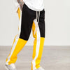 Pantalon Jogging noir jaune vue de profil
